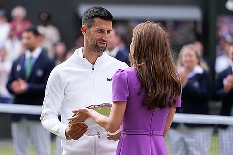Novak Djokovic receives his trophy from Kate, Princess of Wales